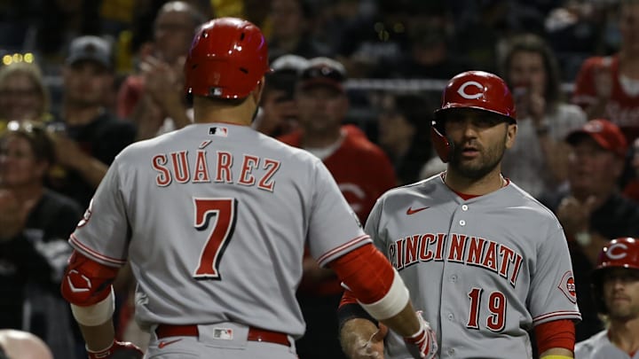 Cincinnati Reds first baseman Joey Votto (19) and third baseman Eugenio Suárez.