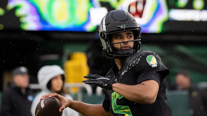 Oregon quarterback Dante Moore throws a pass before the game as the Oregon Ducks host the Wisconsin Badgers on Oct. 25, 2025, at Autzen Stadium in Eugene, Oregon.