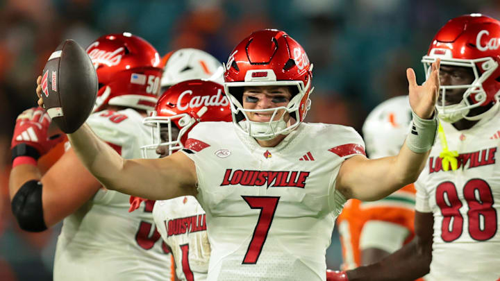 Oct 17, 2025; Miami Gardens, Florida, USA; Louisville Cardinals quarterback Miller Moss (7) celebrates after winning the game against the Miami Hurricanes at Hard Rock Stadium. Mandatory Credit: Sam Navarro-Imagn Images