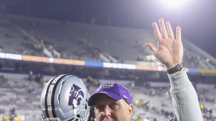 Oct 19, 2024; Morgantown, West Virginia, USA; Kansas State Wildcats head coach Chris Klieman celebrates with fans after defeating the West Virginia Mountaineers at Mountaineer Field at Milan Puskar Stadium. Mandatory Credit: Ben Queen-Imagn Images