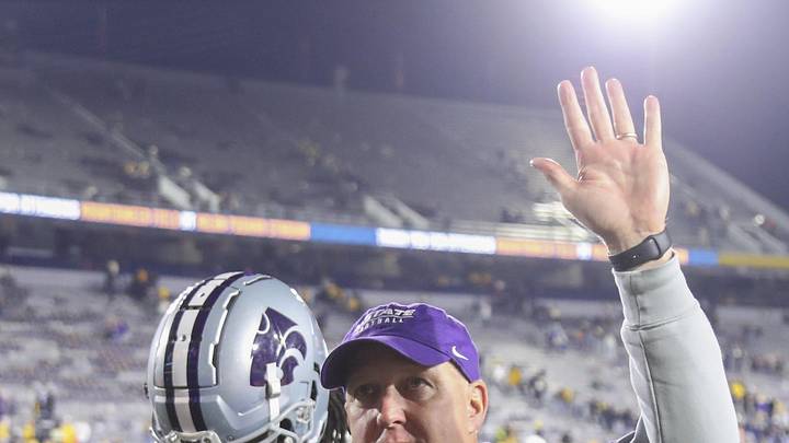 Oct 19, 2024; Morgantown, West Virginia, USA; Kansas State Wildcats head coach Chris Klieman celebrates with fans after defeating the West Virginia Mountaineers at Mountaineer Field at Milan Puskar Stadium. Mandatory Credit: Ben Queen-Imagn Images Oct 19, 2024; Morgantown, West Virginia, USA; Kansas State Wildcats head coach Chris Klieman celebrates with fans after defeating the West Virginia Mountaineers at Mountaineer Field at Milan Puskar Stadium. Mandatory Credit: Ben Queen-Imagn Images