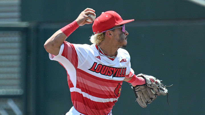 Jun 15, 2025; Omaha, Neb, USA; Louisville Cardinals shortstop Alex Alicea (0) completes a double play against the Arizona Wildcats during the second inning at Charles Schwab Field. Mandatory Credit: Steven Branscombe-Imagn Images