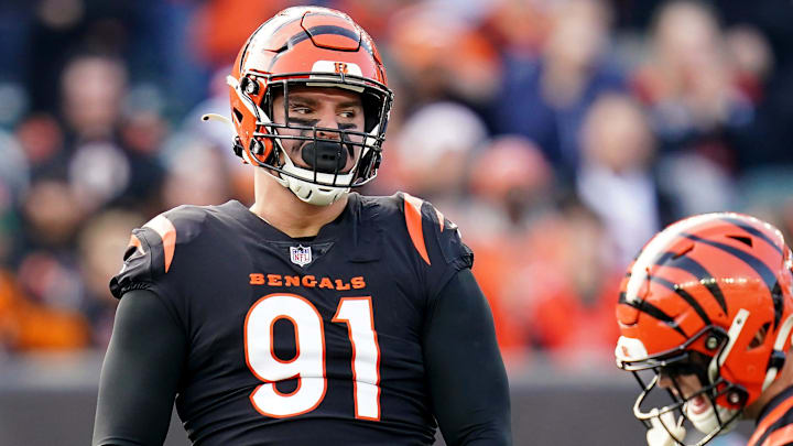 Cincinnati Bengals defensive end Trey Hendrickson (91), left, and Cincinnati Bengals defensive end Sam Hubbard (94) celebrate a sack in the second quarter during a Week 16 NFL game against the Baltimore Ravens, Sunday, Dec. 26, 2021, at Paul Brown Stadium in Cincinnati.