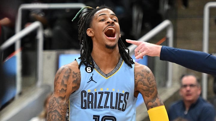 Dec 29, 2022; Toronto, Ontario, CAN;  Memphis Grizzlies guard Ja Morant (12) reacts after a scoring play beside head coach Taylor Jenkins in the second half against the Toronto Raptors at Scotiabank Arena. Mandatory Credit: Dan Hamilton-Imagn Images
