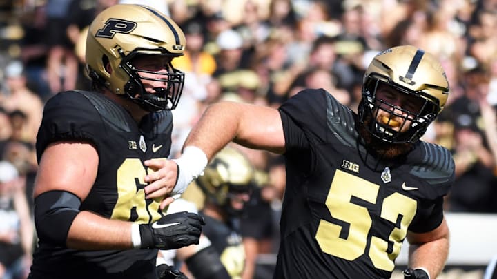 Sep 10, 2022; West Lafayette, Indiana, USA;  Purdue Boilermakers offensive lineman Gus Hartwig (53) celebrates with Purdue Boilermakers offensive lineman Marcus Mbow (63) after a touchdown during the first quarter against Indiana State Sycamores at Ross-Ade Stadium. Mandatory Credit: Robert Goddin-Imagn Images