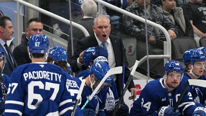 Sep 22, 2024; Toronto, Ontario, CAN;  Toronto Maple Leafs head coach Craig Berube speaks to his players in the first period against the Ottawa Senators at Scotiabank Arena. Mandatory Credit: Dan Hamilton-Imagn Images