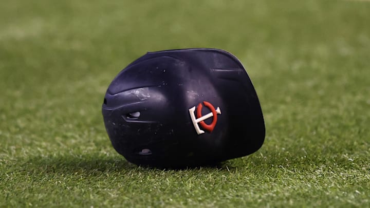  Detailed view of a Minnesota Twins batting helmet on the field against the Arizona Diamondbacks at Chase Field in 2022.