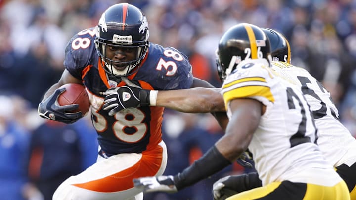 Jan 22, 2006; Denver, CO, USA; Denver Broncos running back (38) Mike Anderson is stopped by Pittsburgh Steelers cornerback (26) Deshea Townsend during the 4th quarter of the AFC Championship Game at Invesco Field at Mile High.