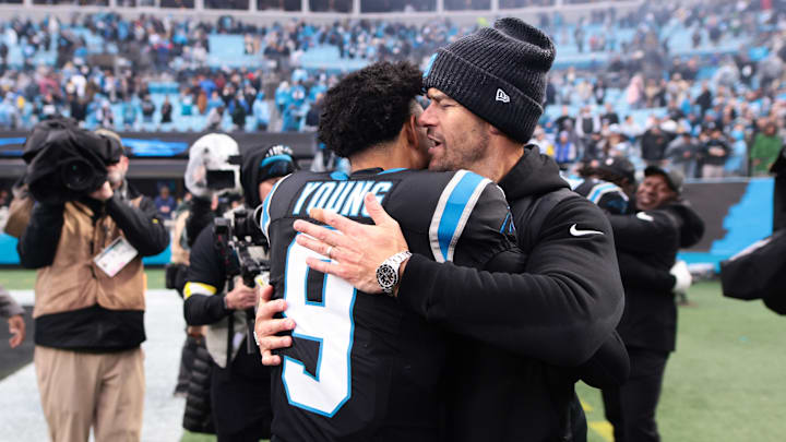 Nov 30, 2025; Charlotte, North Carolina, USA; Carolina Panthers head coach Dave Canales celebrates with Carolina Panthers quarterback Bryce Young (9) after the game against the Los Angeles Rams at Bank of America Stadium.