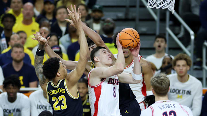 Apr 4, 2026; Indianapolis, IN, USA; Arizona Wildcats forward Ivan Kharchenkov (8) goes to the basket against Michigan Wolverines center Aday Mara (15) in the first half during a semifinal of the Final Four of the men's 2026 NCAA Tournament at Lucas Oil Stadium. Mandatory Credit: Trevor Ruszkowski-Imagn Images