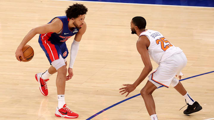 Jan 13, 2025; New York, New York, USA; Detroit Pistons guard Cade Cunningham (2) controls the ball against New York Knicks forward Mikal Bridges (25) during the fourth quarter at Madison Square Garden. Mandatory Credit: Brad Penner-Imagn Images