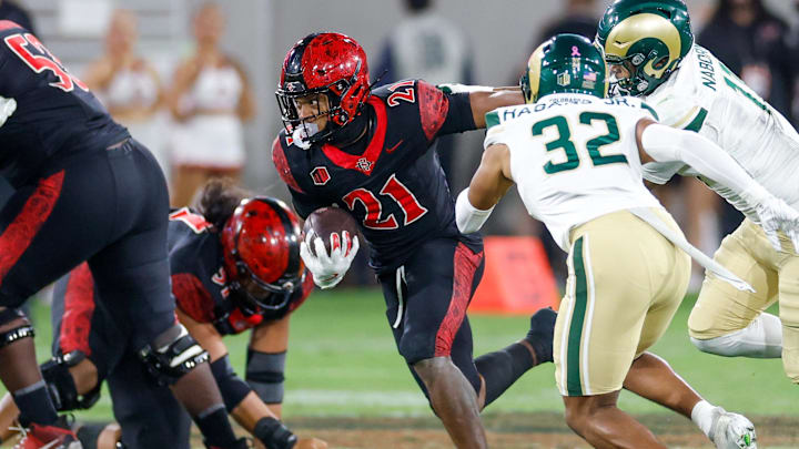 Oct 3, 2025; San Diego, California, USA; San Diego State Aztecs running back Byron Cardwell Jr. (21) runs the ball during the second half against the Colorado State Rams at Snapdragon Stadium. Oct 3, 2025; San Diego, California, USA; San Diego State Aztecs running back Byron Cardwell Jr. (21) runs the ball during the second half against the Colorado State Rams at Snapdragon Stadium.