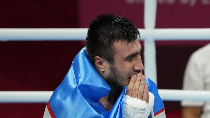 Aug 8, 2021; Tokyo, Japan; Bakhodir Jalolov (UZB) celebrates after his match against Richard Torrez Jr (USA) in the men's super heavy +91kg final bout during the Tokyo 2020 Olympic Summer Games at Kokugikan Arena.