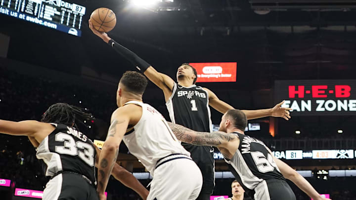 Apr 12, 2024; San Antonio, Texas, USA; San Antonio Spurs forward Victor Wembanyama (1) reaches for a rebound during the first half against the Denver Nuggets at Frost Bank Center. Mandatory Credit: Scott Wachter-Imagn Images Apr 12, 2024; San Antonio, Texas, USA; San Antonio Spurs forward Victor Wembanyama (1) reaches for a rebound during the first half against the Denver Nuggets at Frost Bank Center. Mandatory Credit: Scott Wachter-Imagn Images