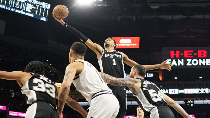 Apr 12, 2024; San Antonio, Texas, USA; San Antonio Spurs forward Victor Wembanyama (1) reaches for a rebound during the first half against the Denver Nuggets at Frost Bank Center. Mandatory Credit: Scott Wachter-USA TODAY Sports Apr 12, 2024; San Antonio, Texas, USA; San Antonio Spurs forward Victor Wembanyama (1) reaches for a rebound during the first half against the Denver Nuggets at Frost Bank Center. Mandatory Credit: Scott Wachter-USA TODAY Sports