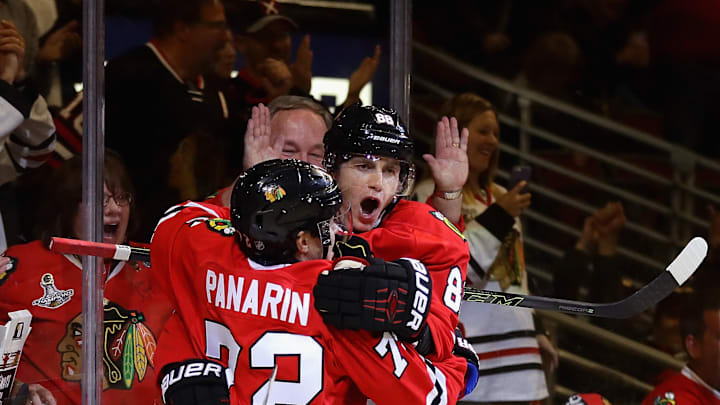 Artemi Panarin and Patrick Kane celebrate a goal