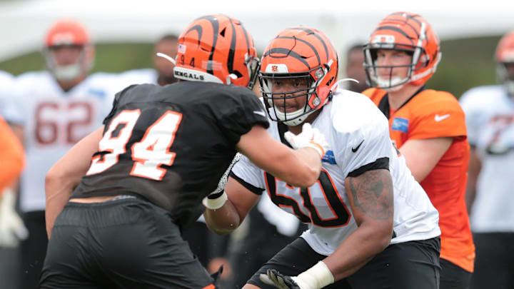 Cincinnati Bengals offensive guard Michael Jordan (60) blocks Cincinnati Bengals defensive end Sam Hubbard (94) as Cincinnati Bengals quarterback Andy Dalton (14) takes the snap during Cincinnati Bengals training camp practice, Tuesday, Aug. 13, 2019, at the practice fields next to Paul Brown Stadium in Cincinnati.
Cincinnati Bengals Training Camp Aug 13 Cincinnati Bengals offensive guard Michael Jordan (60) blocks Cincinnati Bengals defensive end Sam Hubbard (94) as Cincinnati Bengals quarterback Andy Dalton (14) takes the snap during Cincinnati Bengals training camp practice, Tuesday, Aug. 13, 2019, at the practice fields next to Paul Brown Stadium in Cincinnati.
Cincinnati Bengals Training Camp Aug 13