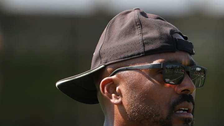 Purdue Boilermakers running backs coach Lamar Conard leads a drill 