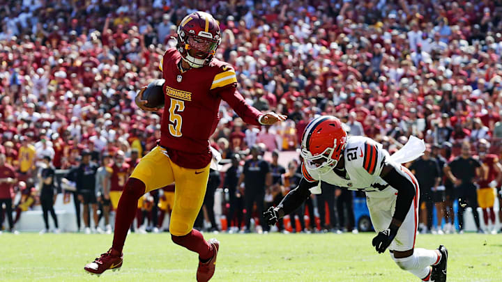 Oct 6, 2024; Landover, Maryland, USA; Washington Commanders quarterback Jayden Daniels (5) runs the ball against Cleveland Browns cornerback Denzel Ward (21) during the first quarter at NorthWest Stadium. Mandatory Credit: Peter Casey-Imagn Images Oct 6, 2024; Landover, Maryland, USA; Washington Commanders quarterback Jayden Daniels (5) runs the ball against Cleveland Browns cornerback Denzel Ward (21) during the first quarter at NorthWest Stadium. Mandatory Credit: Peter Casey-Imagn Images
