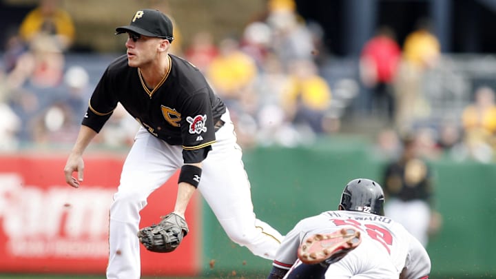 October 3, 2012; Pittsburgh, PA, USA; Atlanta Braves right fielder Jason Heyward (22) steals second base as Pittsburgh Pirates shortstop Clint Barmes (12) looks for the throw during the fourth inning at PNC Park. Mandatory Credit: Charles LeClaire-Imagn Images