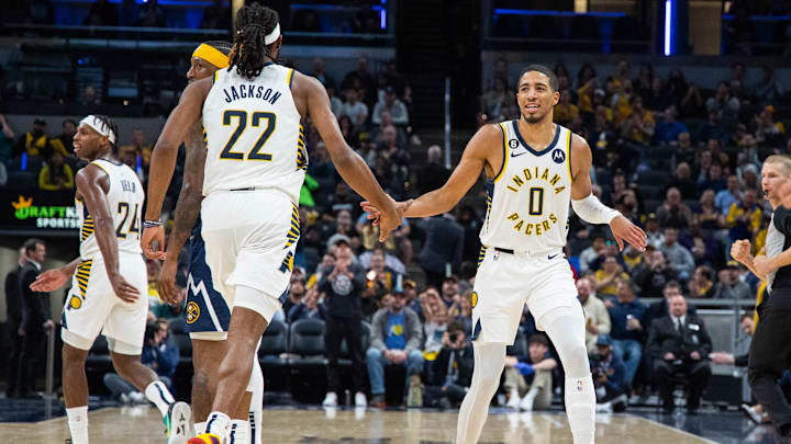 Nov 9, 2022; Indianapolis, Indiana, USA; Indiana Pacers guard Tyrese Haliburton (0) and forward Isaiah Jackson (22) celebrate a made basket in the second quarter against the Denver Nuggets at Gainbridge Fieldhouse. Mandatory Credit: Trevor Ruszkowski-Imagn Images