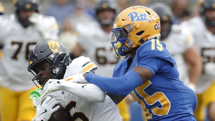 Oct 12, 2024; Pittsburgh, Pennsylvania, USA;  California Golden Bears wide receiver Jonathan Brady (6) is tackled after a catch by Pittsburgh Panthers defensive back Rashad Battle (15) during the first quarter at Acrisure Stadium. Mandatory Credit: Charles LeClaire-Imagn Images