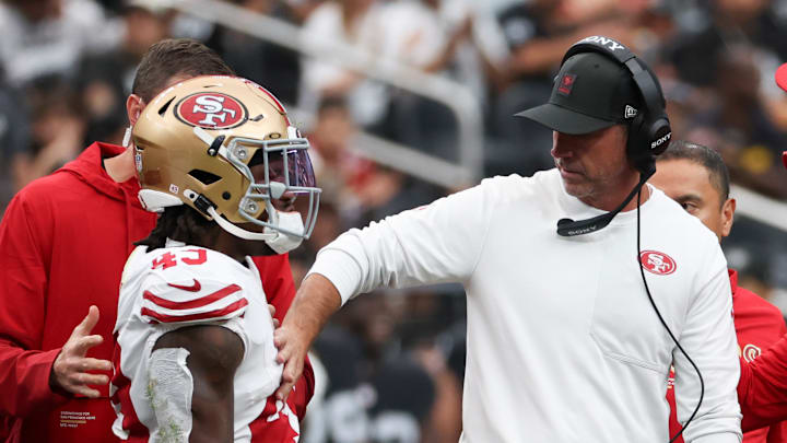 San Francisco 49ers running back Corey Kiner (L) and head coach Kyle Shanahan (R) San Francisco 49ers running back Corey Kiner (L) and head coach Kyle Shanahan (R)