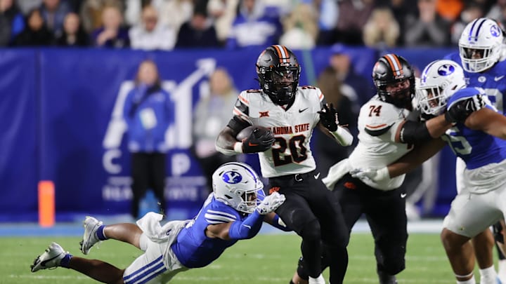 Oct 18, 2024; Provo, Utah, USA; Oklahoma State Cowboys running back Rodney Fields Jr. (20) runs the ball against the Brigham Young Cougars during the third quarter at LaVell Edwards Stadium. Mandatory Credit: Rob Gray-Imagn Images