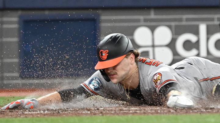 Jun 5, 2026; Toronto, Ontario, CAN;  Baltimore Orioles shortstop Gunnar Henderson (2) slides in to home plate to score a run against the Toronto Blue Jays in the sixth inning at Rogers Centre. Mandatory Credit: Dan Hamilton-Imagn Images