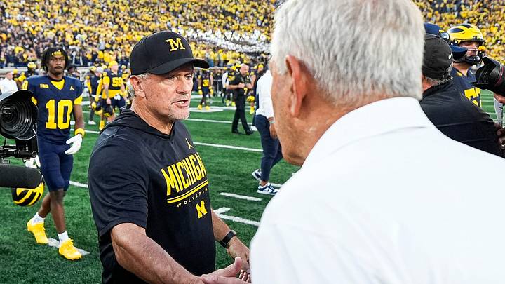Michigan head coach Kyle Whittingham, left, shakes hands with Iowa head coach Kirk Ferentz after 20-19 loss at Michigan Stadium in Ann Arbor on Saturday, Sept. 26, 2026.