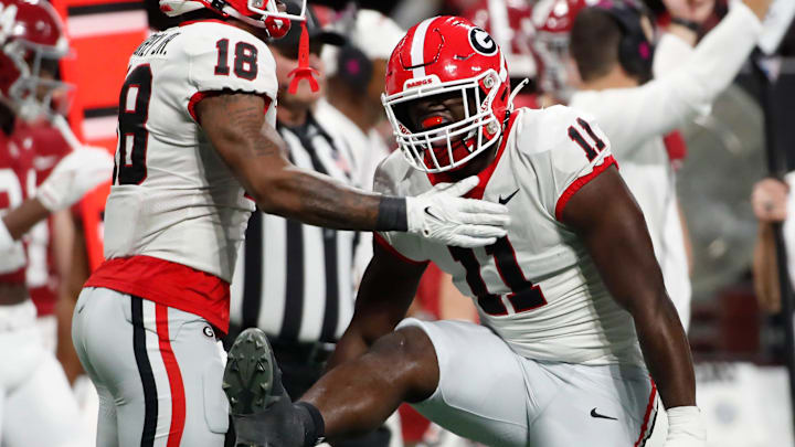 Georgia linebacker Jalon Walker (11) celebrates after sacking Alabama quarterback Jalen Milroe (4) during the first half of the SEC Championship game against Alabama at Mercedes-Benz Stadium in Atlanta, on Saturday, Dec. 2, 2023.