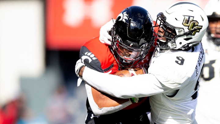 UCF Knights defensive back Divaad Wilson (9) tackles Cincinnati Bearcats running back Ryan Montgomery (22) in the second half of the NCAA football game on Saturday, Oct. 15, 2021, at Nippert Stadium in Cincinnati. Cincinnati Bearcats defeated UCF Knights 56-21.
Ucf Knights At Cincinnati Bearcats 152 UCF Knights defensive back Divaad Wilson (9) tackles Cincinnati Bearcats running back Ryan Montgomery (22) in the second half of the NCAA football game on Saturday, Oct. 15, 2021, at Nippert Stadium in Cincinnati. Cincinnati Bearcats defeated UCF Knights 56-21.
Ucf Knights At Cincinnati Bearcats 152