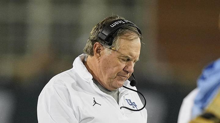 Sep 6, 2025; Charlotte, North Carolina, USA; North Carolina Tar Heels head coach Bill Belichick looks at his iPad during the second half against the Charlotte 49ers at Jerry Richardson Stadium. Mandatory Credit: Jim Dedmon-Imagn Images Sep 6, 2025; Charlotte, North Carolina, USA; North Carolina Tar Heels head coach Bill Belichick looks at his iPad during the second half against the Charlotte 49ers at Jerry Richardson Stadium. Mandatory Credit: Jim Dedmon-Imagn Images