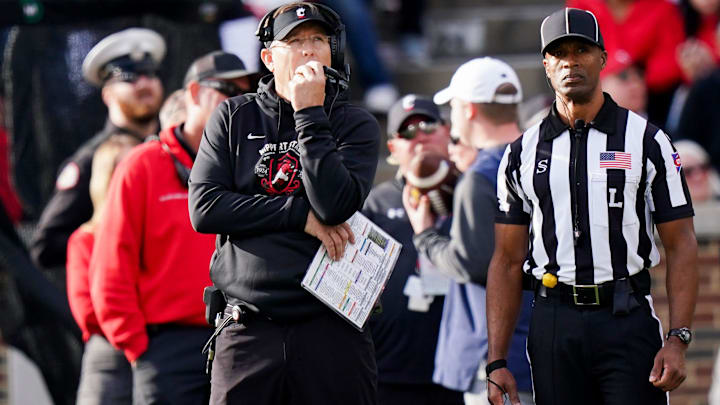 Cincinnati Bearcats head coach Scott Satterfield, left, watches an instant replay video on the jumbo screen in the fourth quarter of a college football game between the Cincinnati Bearcats and West Virginia Mountaineers, Saturday, Nov. 9, 2024, at Nippert Stadium in Cincinnati. Mountaineers won 31-24. Cincinnati Bearcats head coach Scott Satterfield, left, watches an instant replay video on the jumbo screen in the fourth quarter of a college football game between the Cincinnati Bearcats and West Virginia Mountaineers, Saturday, Nov. 9, 2024, at Nippert Stadium in Cincinnati. Mountaineers won 31-24.