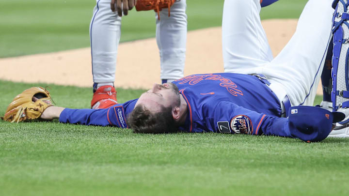 New York City, New York, USA; New York Mets starting pitcher Griffin Canning (46) lays on the ground after getting injured in the third inning against the Atlanta Braves at Citi Field.