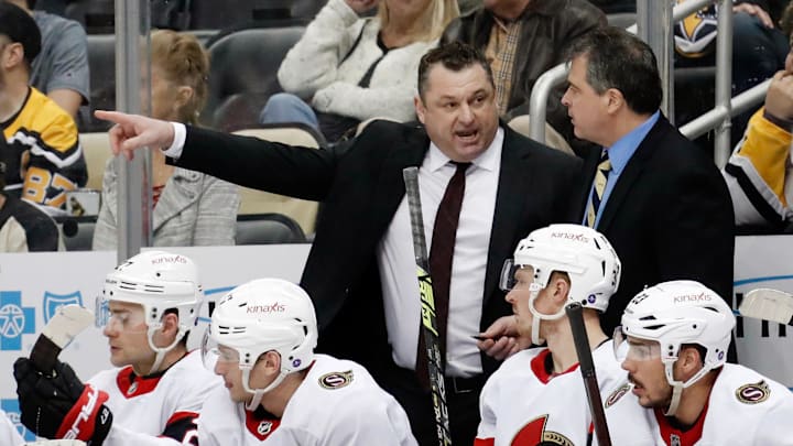 Mar 20, 2023; Pittsburgh, Pennsylvania, USA;  Ottawa Senators head coach D.J. Smith (left) talks with associate coach Jack Capuano (right) on the bench against the Pittsburgh Penguins at PPG Paints Arena. Mandatory Credit: Charles LeClaire-Imagn Images