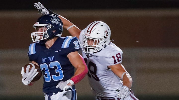 Bay Port High School's Brady Moon (33) breaks a tackle by De Pere High School's Cayden Cavanaugh (18) on his way to scoring a touchdown on Friday, October 3, 2025, at Bay Port High School in Suamico, Wis. Bay Port won the game, 56-7.
Tork Mason/USA TODAY NETWORK-Wisconsin