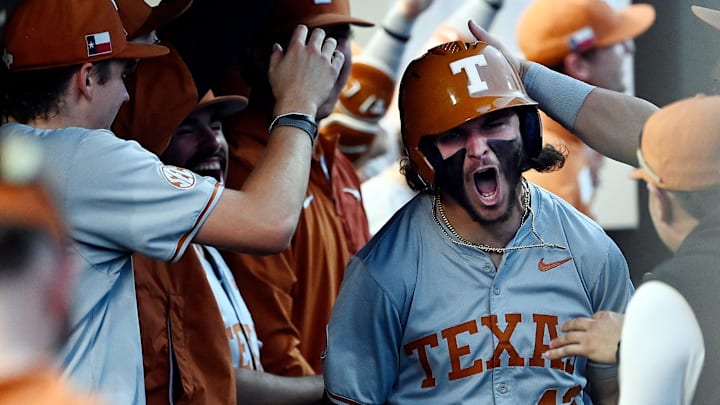 Texas’ Aiden Robbins (43) celebrates with teammates after hitting his second home run of the game against Vanderbilt.