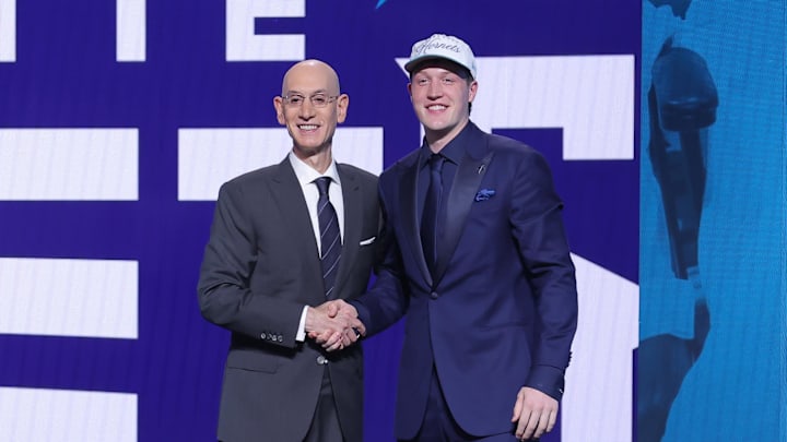 Jun 25, 2025; Brooklyn, NY, USA;  Kon Knueppel stands with NBA commissioner Adam Silver after being selected as the fourth pick by the Charlotte Hornets in the first round of the 2025 NBA Draft at Barclays Center. Mandatory Credit: Brad Penner-Imagn Images