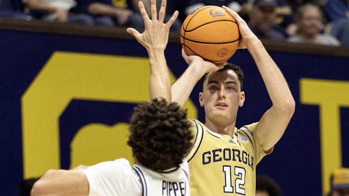 Feb 4, 2026; Berkeley, California, USA; Georgia Tech Yellow Jackets guard Kam Craft (12) shoots over California Golden Bears guard Justin Pippen (10) during the first half at Haas Pavilion. Mandatory Credit: D. Ross Cameron-Imagn Images