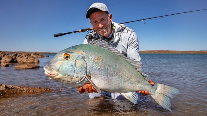 Trophy angler Craig Williams celebrates his IGFA World Record Blue Bastard along the Australian coast.