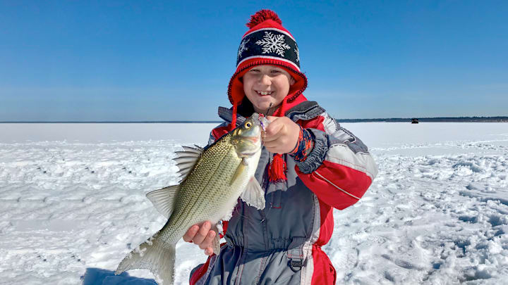 Taking kids ice fishing is a good way to get them interested in the outdoors. Keep them warm and entertained and your fishing trip will be a positive experience. 