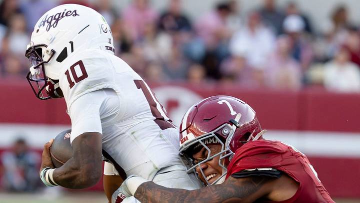 Oct 24, 2026; Tuscaloosa, AL, USA; Texas A&M quarterback Marcel Reed (10) is tackled behind the line of scrimmage on a running play by Alabama linebacker Caleb Woodson (7) at Saban Field at Bryant Denny Stadium. Alabama defeated Texas A&M 31-20. Mandatory Credit: Gary Cosby Jr.-Tuscaloosa News Oct 24, 2026; Tuscaloosa, AL, USA; Texas A&M quarterback Marcel Reed (10) is tackled behind the line of scrimmage on a running play by Alabama linebacker Caleb Woodson (7) at Saban Field at Bryant Denny Stadium. Alabama defeated Texas A&M 31-20. Mandatory Credit: Gary Cosby Jr.-Tuscaloosa News