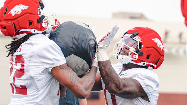 Arkansas Razorbacks TJ Hodges and Braylen Russell during spring practice drill. Arkansas Razorbacks TJ Hodges and Braylen Russell during spring practice drill.