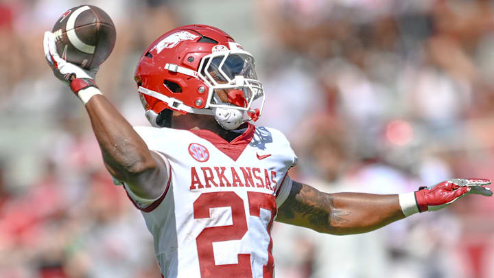 Arkansas Razorbacks running back Cam Settles attempts a pass for a 2-point conversion on the last play of the Red-White Game.
