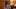 "Student with a colorful sweater and styled hair sits at a desk in a classroom, writing in a notebook." "Student with a colorful sweater and styled hair sits at a desk in a classroom, writing in a notebook."