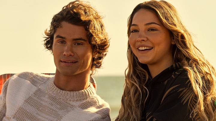 Outer Banks. (L to R) Chase Stokes as John B, Madelyn Cline as Sarah Cameron in episode 404 of Outer Banks. Cr. Jackson Lee Davis/Netflix © 2024 Outer Banks. (L to R) Chase Stokes as John B, Madelyn Cline as Sarah Cameron in episode 404 of Outer Banks. Cr. Jackson Lee Davis/Netflix © 2024