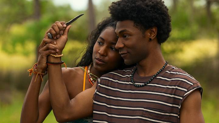 Outer Banks. (L to R) Carlacia Grant as Cleo, Jonathan Daviss as Pope in episode 506 of Outer Banks. Cr. Jackson Lee Davis/Netflix © 2026 Outer Banks. (L to R) Carlacia Grant as Cleo, Jonathan Daviss as Pope in episode 506 of Outer Banks. Cr. Jackson Lee Davis/Netflix © 2026