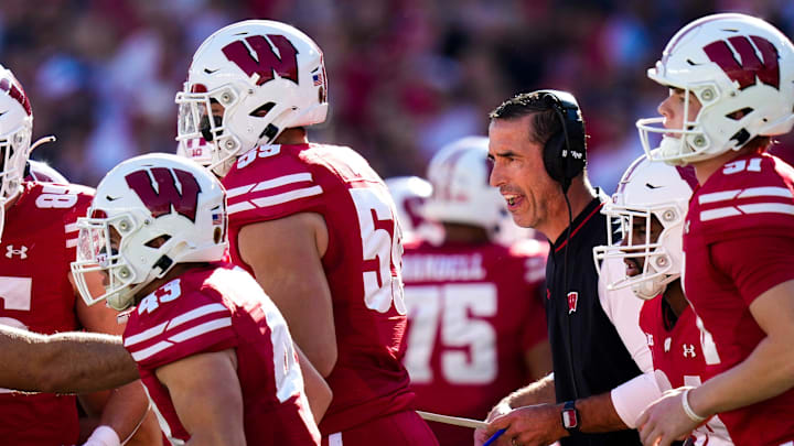 Wisconsin Badgers head coach Luke Fickell speaks to his players in the first half at Camp Randall Stadium on Saturday, Oct. 18, 2025 in Madison, Wisconsin.