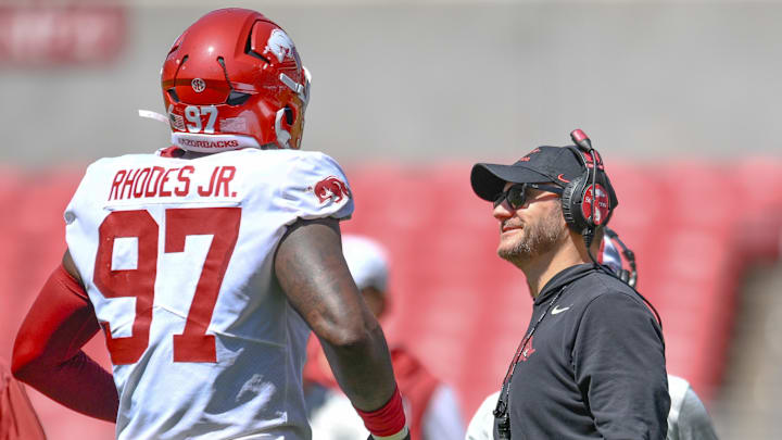 Arkansas Razorbacks defensive lineman Quincy Rhodes and coach Ryan Silverfield.